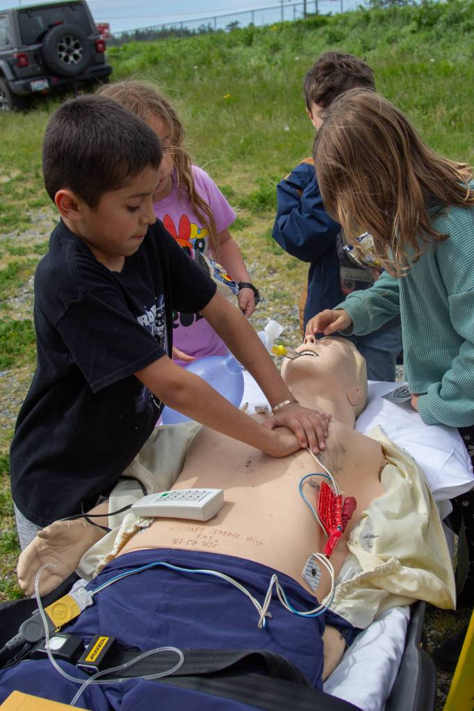 Photo by Caitlyn Anderson
Leo Hernandez practices CPR on an ambulance dummy at the Touch-a-Truck event.