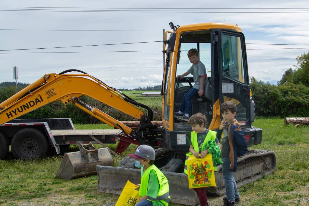 Photo by Caitlyn Anderson
Aiden Stevens plays with the track pedals and levers in a backhoe at the Touch-a-Truck event.