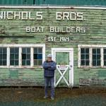 Photo by David Welton
Nichols poses in front of an original building at the Freeland site.