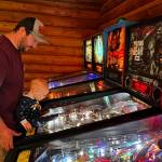 Photo provided
Tossin Axes patrons play pinball at Fridays launch tournament.