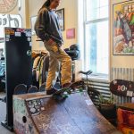 Photo by Luisa Loi
Collins prepares to roll down a litte ramp inside his store.