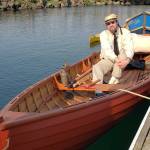 Michael Buse, a history teacher in Olympia, sits in a historical replica boat he built. (Photo provided)