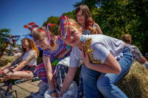 Photo by David Welton
A girl with a lizard fit right in the Fourth of July parade and celebration at Maxwelton. The day was a celebration of all things Americana, with the usual eclectic collection of folks.