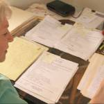 Jennifer Townsend reviews survey responses from over two decades ago. (Photo provided)