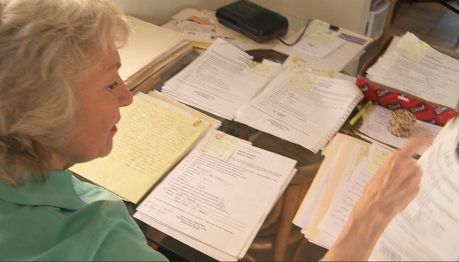 Jennifer Townsend reviews survey responses from over two decades ago. (Photo provided)