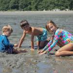 Photo by Caitlyn Anderson
From left, brothers Henry and Charlie Katz and their cousin Penelope Hemker dig a hole in the sand at Double Bluff Beach, July 9.