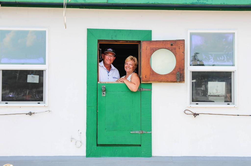 Dennis and Kat smile through the dutch doors window. (Photo by Luisa Loi)