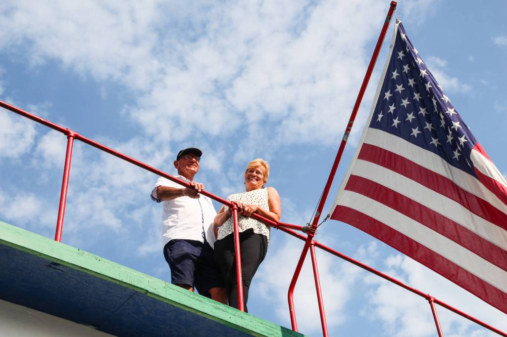 Kat and Dennis Redmon admire the view from the top floor of their ferry house. (Photo by Luisa Loi)