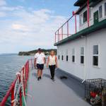 Dennis and Kat Redmon walk around the ferry they transformed into a home. (Photo by Luisa Loi)