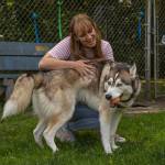 WAIF Communications and Events Coordinator Karina Andrew pets Abott. (Photo by Caitlyn Anderson)