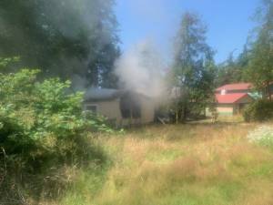 Photo provided by South Whidbey Fire/EMS
Firefighters responded to a blaze at an East Harbor Road address Friday.