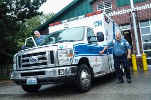 Photo by Sam Fletcher
Tom Cross, WhidbeyHealth paramedic, loads into an ambulance with his partner.