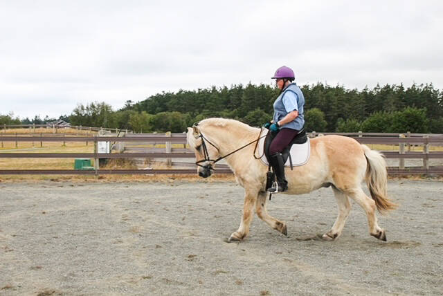 Pat Lamont rides Merit at a horse riding arena on North Whidbey. (Photo by Luisa Loi)