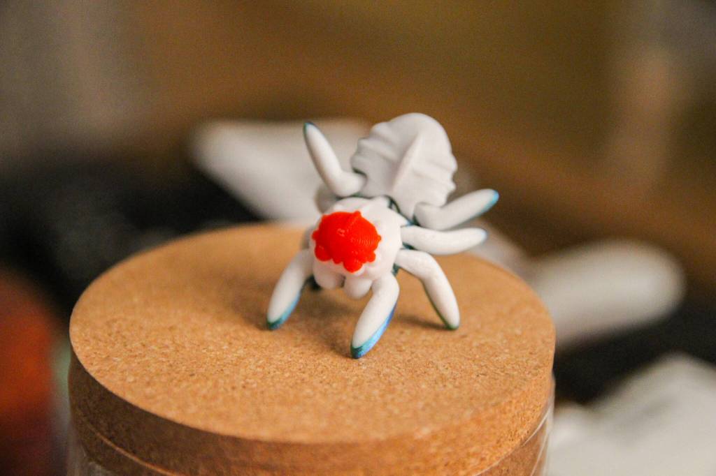Gray Matter 3D Printing also creates palm-sized spiders that can be posed and used as fidget toys. (Photo by Luisa Loi)