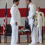 Commanding Officer Capt. Eric Hanks greets Rear Admiral Mark Sucato at his change of command ceremony on Thursday. (Photo by Sam Fletcher)