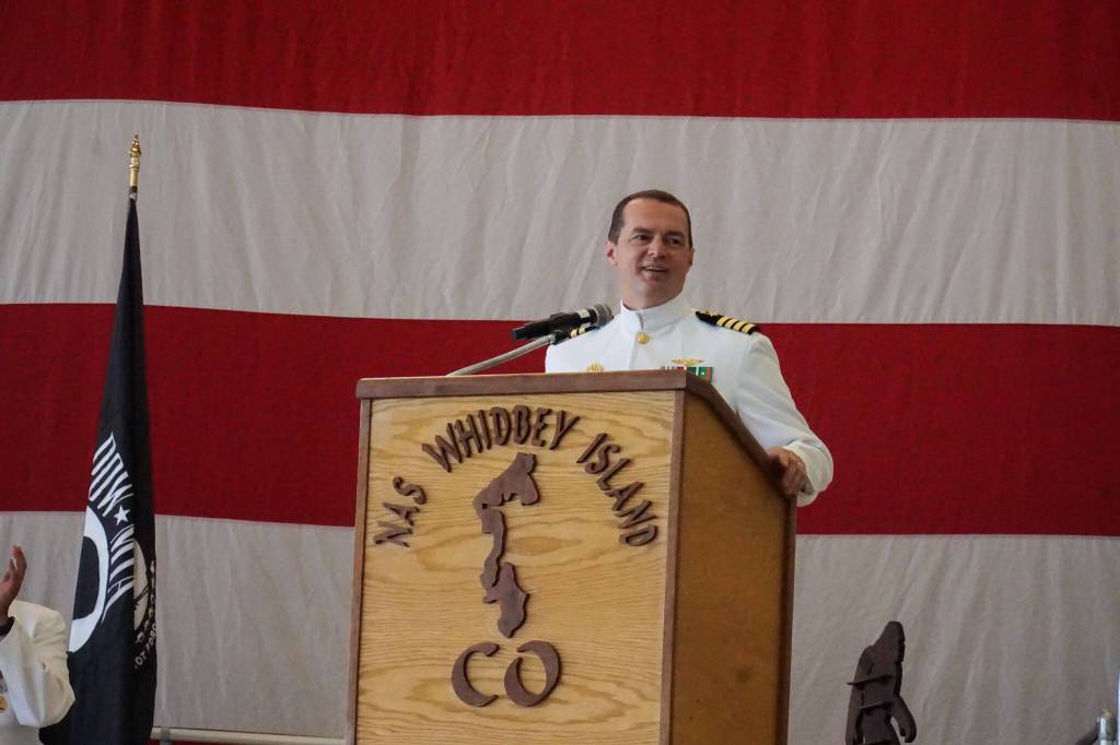 Capt. Nathan Gammache addresses Naval Air Station Whidbey Island for the first time as commanding officer at Thursdays change of command ceremony. (Photo by Sam Fletcher)
