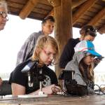 Brenden Vandervort observes plankton he collected with a robot he built in the Atlantis STEAM robotics course. (Photo by Sam Fletcher)