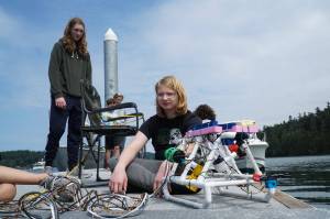 Photo by Sam Fletcher
Brenden Vandervort sits with a robot he built at Cornet Bay on Friday.