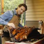 Glen Pearson of Clinton sands the epoxy coating he applied to a twisted and gnarled piece of maple. (Photo by Kira Erickson/South Whidbey Record)