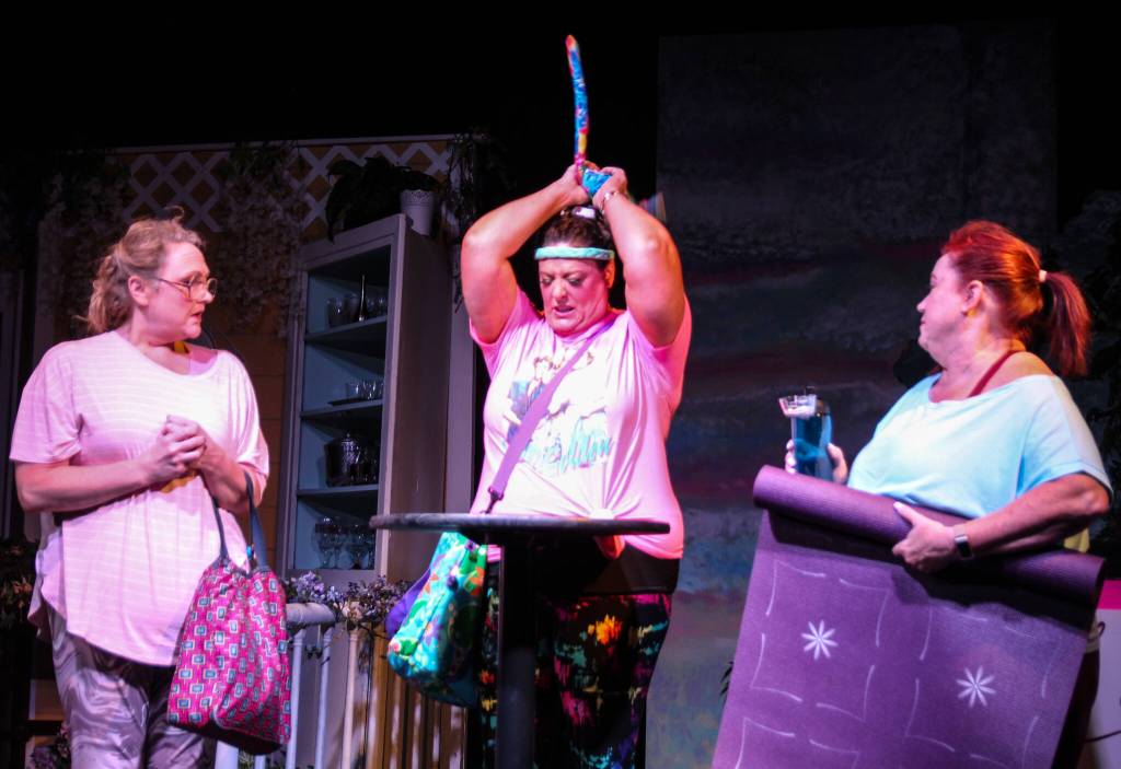 Marlafaye (Katie Jones, in the middle) demonstrates how she relieves stress following a messy divorce and a harrowing yoga class. (Photo by Luisa Loi)