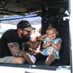 Photo by Sam Fletcher
Connor Kusick plays with his daughter, Kaylee, in the Search and Rescue helicopter at Naval Air Station Whidbey Island on Saturday.