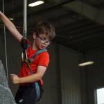 Ben Hopfinger scales the rock climbing wall at Naval Air Station Whidbey Island on Saturday. (Photo by Sam Fletcher)