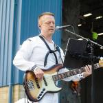 MU3 Jeremy Sauer leads the Navy Band Northwest at Naval Air Station Whidbey Island on Saturday. (Photo by Sam Fletcher)