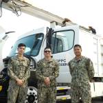 Left to right: AS3 Benjamin Ruba, AS2 Wilton Rosaedoadujar and Airman Nelmar Obaza pose at the Naval Air Station Whidbey Island open house on Saturday. (Photo by Sam Fletcher)