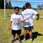 Jayson White, 8, points out a phrase on the back of his 11-year-old sister Raynas shirt that promotes Dr. Robyn Whites One Million Mammograms campaign. (Photo provided)