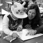 Superintendent Michelle Kuss-Cybula helps a student.