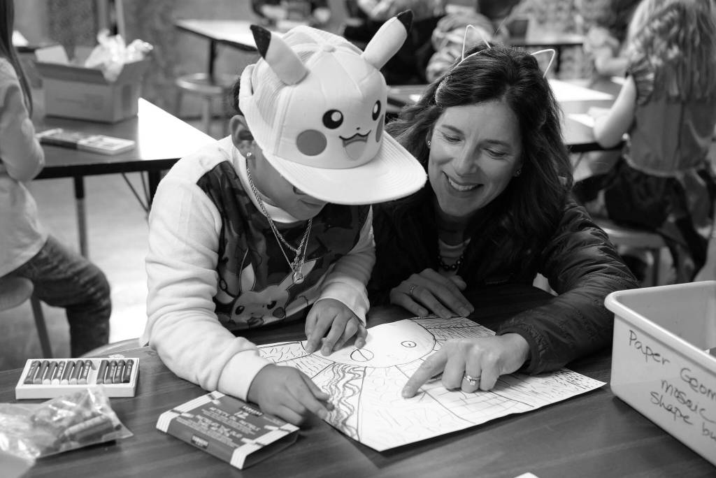 Superintendent Michelle Kuss-Cybula helps a student.