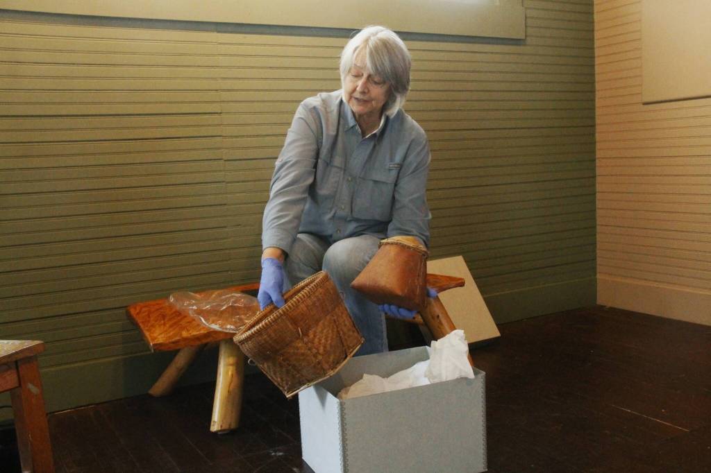 (Photo by Kira Erickson/South Whidbey Record)
Kyle Walker unearths a birch box, right, and a burden basket from a collection of indigenous artifacts.