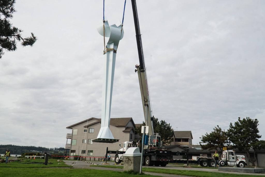 The Angel De Creatividad sculpture took flight on Wednesday as Ram Construction riggers move it in place. (Photo by Sam Fletcher)