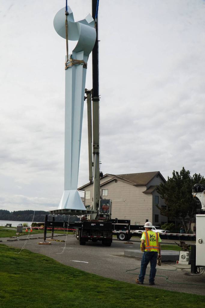 The Angel De Creatividad sculpture took flight on Wednesday as Ram Construction riggers move it in place. (Photo by Sam Fletcher)