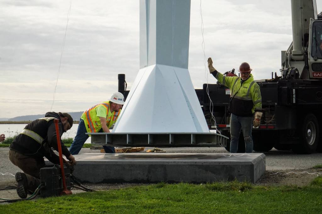Ram Construction staff prepare to mount the Angel De Creatividad sculpture on its platform on Wednesday. (Photo by Sam Fletcher)