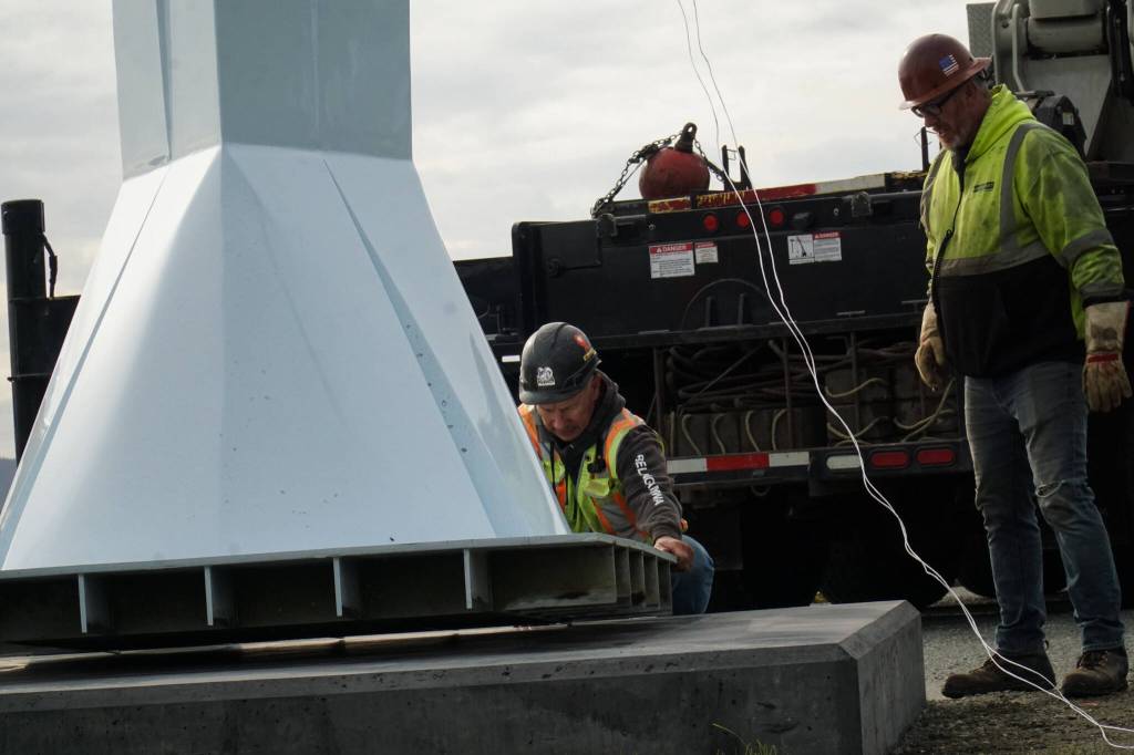 Ram Construction staff hoist the horizontal Angel De Creatividad sculpture upright on Wednesday. (Photo by Sam Fletcher)
Ram Construction staff prepare to mount the Angel De Creatividad sculpture on its platform on Wednesday. (Photo by Sam Fletcher)