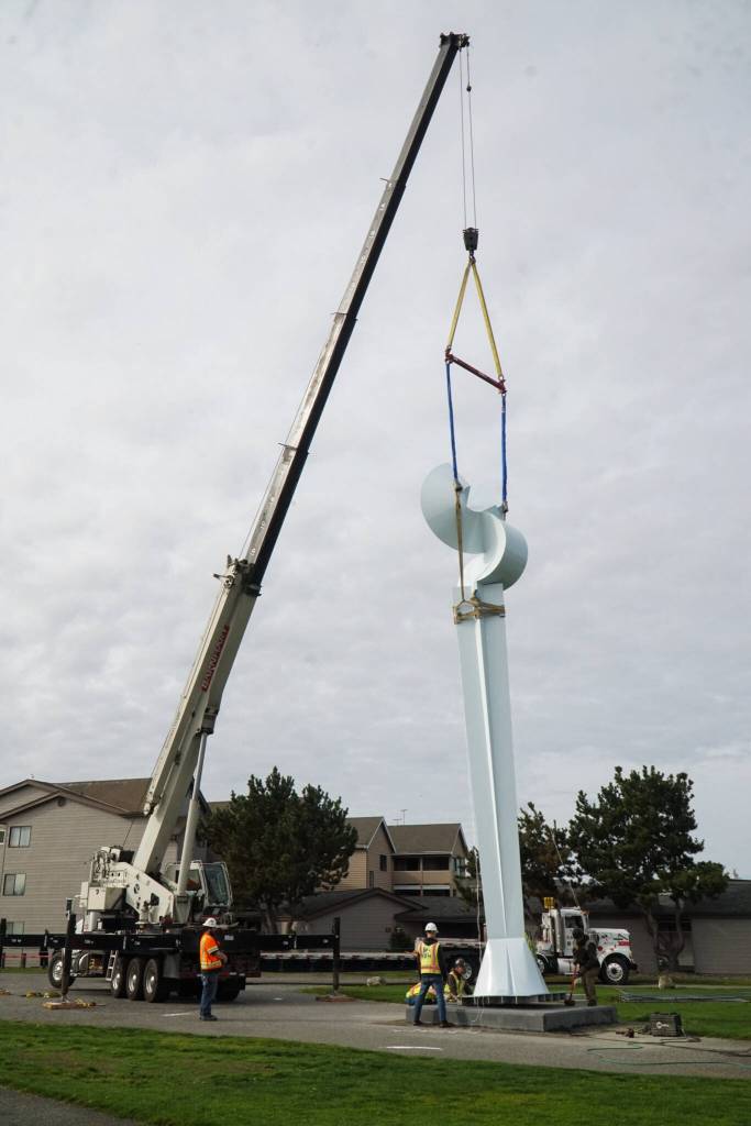 Ram Construction staff prepare to mount the Angel De Creatividad sculpture on its platform on Wednesday. 
Photo by Sam Fletcher