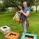 Photo provided
Woodhaven junior Maggie Hogan holds a bag of apples.