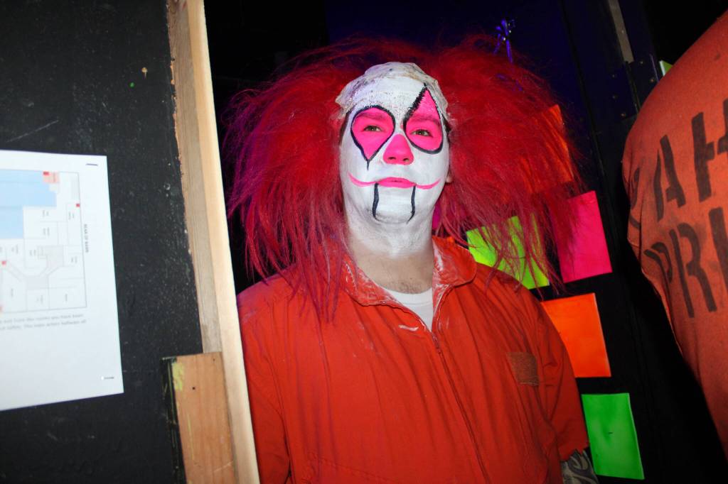 Cackles the Clown stands in the clown room of Twisted Manor at the Oak Harbor Roller Barn.