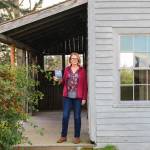 (Photo by Luisa Loi)
Victoria Shea holds The Ghosts of Whidbey Island, a project that took two years of research and writing.