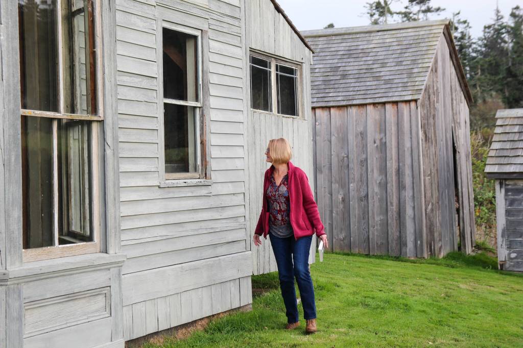 (Photo by Luisa Loi)
Victoria Shea peeks inside the Ferry House, which was once a tavern, a post office and an inn owned by the Ebey family.