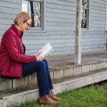 (Photo by Luisa Loi)
Shea reads her book on the porch of the house located near where Isaac Ebeys home once stood.