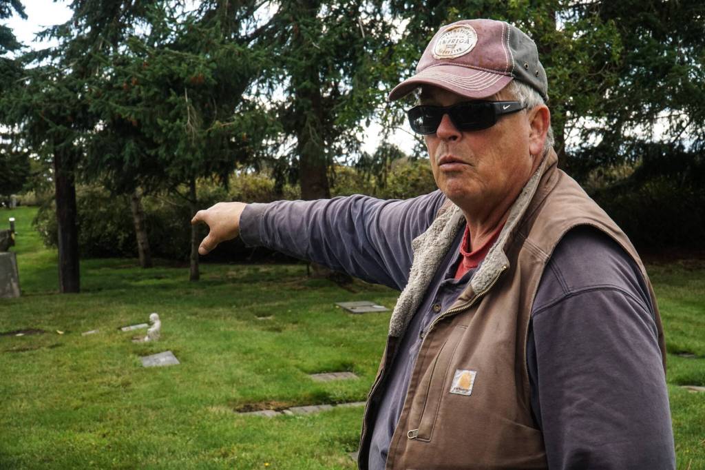 Steve Deakin, groundskeeper at Sunnyside Cemetery, points to Kettle family plots. (Photo by Sam Fletcher)