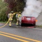 (Photo provided by South Whidbey Fire/EMS)
Firefighters worked to put out a blazing car Thursday morning in Freeland.