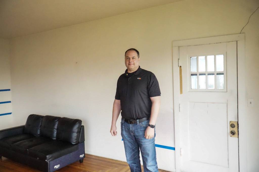 Reese Bliek, owner of Coppertop Construction, plans to restore the old Pioneer Way home and move it to the adjacent lot. (Photo by Sam Fletcher)