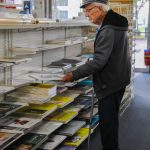 After 60 years of working at the store, Gene isnt interested in quitting what he loves doing. (Photo by Luisa Loi)