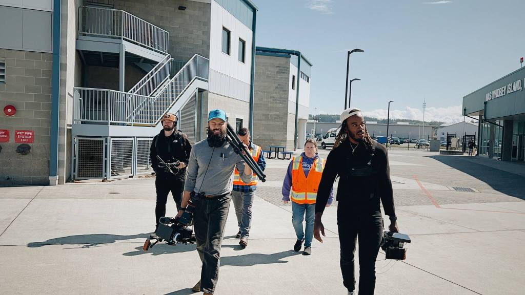(Photo provided)
The Working on Whidbey crew walks on Navy Air Station Whidbey Island for a future episode.