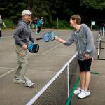 (Photo by David Welton)
Pickleball players Steve Eldridge and Lee Benner meet on the temporary courts at the South Whidbey Sports Complex.