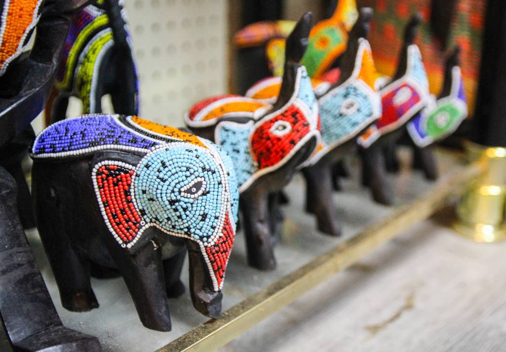 (Photo by Luisa Loi)
Wooden elephant sculptures with colorful beads.