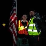 Heidi Hiatt and Don Scoby of the Scottish American Military Society show support at the procession of Serena Wileman, an aviator who recently lost her life. (Photo by Sam Fletcher)